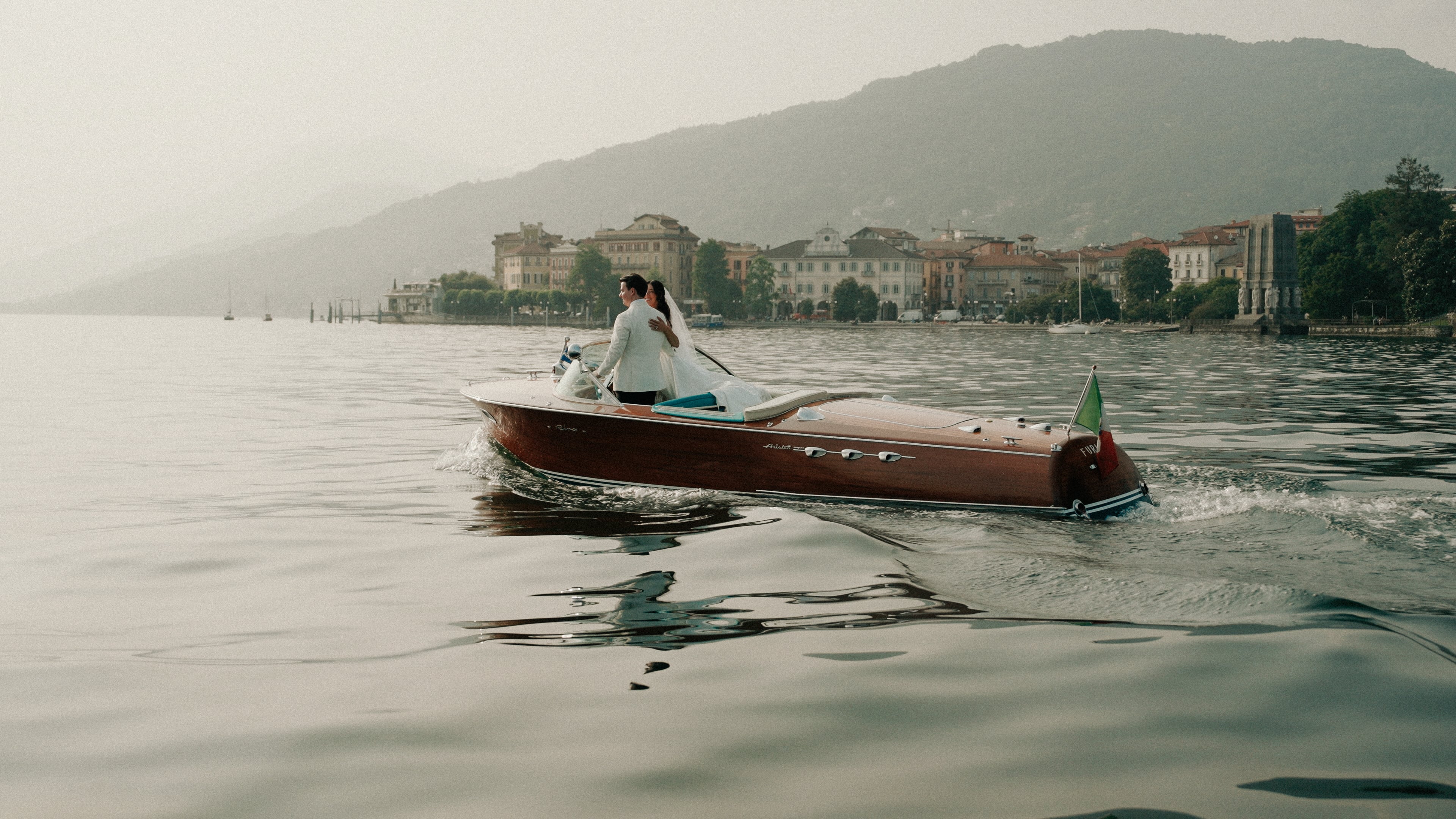 Wedding couple on a boat on Lake Como