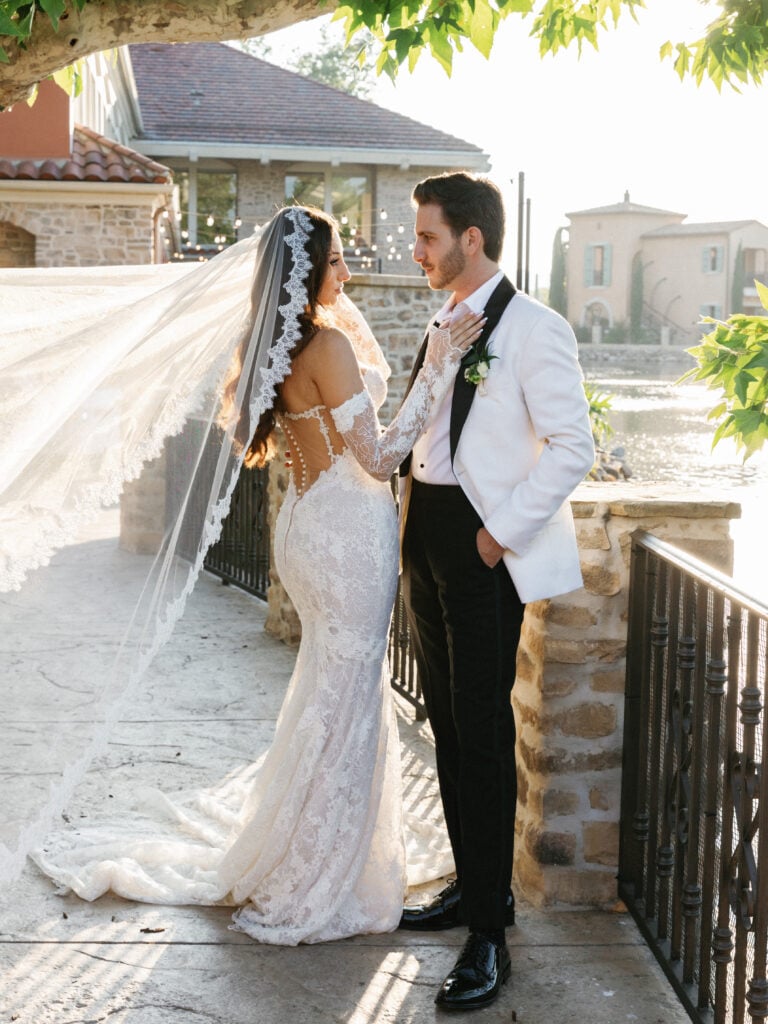 Cinematic wedding dress movement with a cathedral veil captured during golden hour wedding coverage hours.