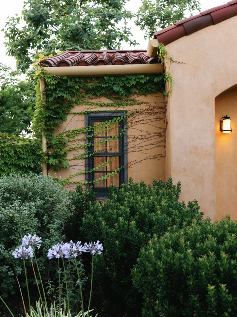 Italianate architecture style villa with ivy-covered walls at Hummingbird Nest Ranch, captured during morning wedding coverage hours.