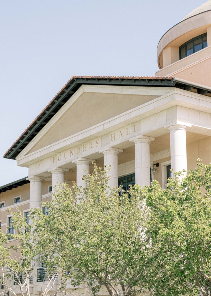 Grand neoclassical facade of Founders Hall at Soka University, offering bright architectural backdrops for luxury wedding venue photography.