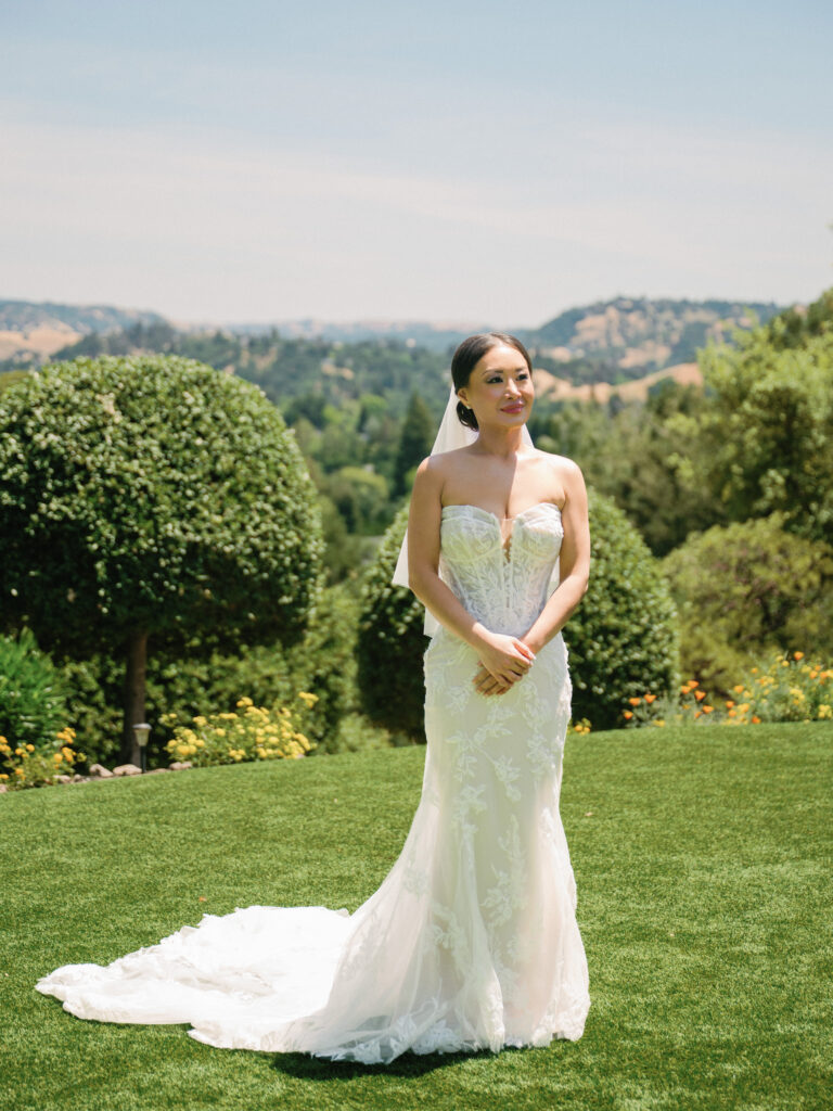 Elegant bridal portrait on film showcasing a lace strapless gown with a cathedral veil, captured by a Napa Valley wedding photographer.